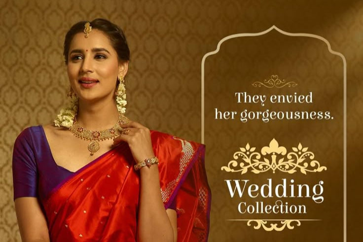Woman in a red saree with jewelry, featuring Reliance Jewels branding on a brown background.